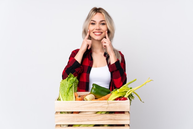 Farmer woman over isolated wall