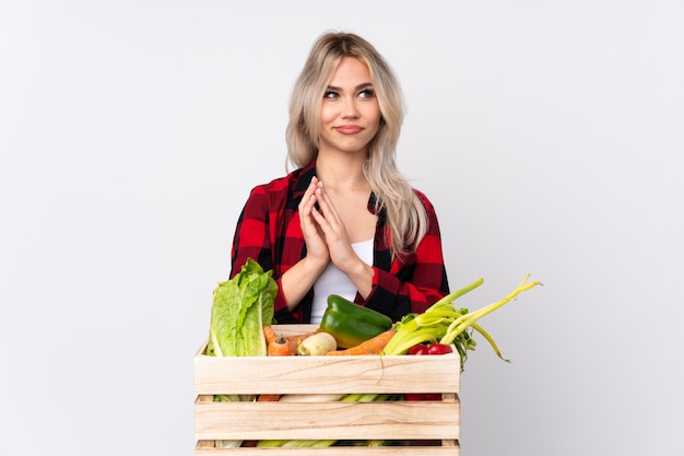 Farmer woman over isolated wall