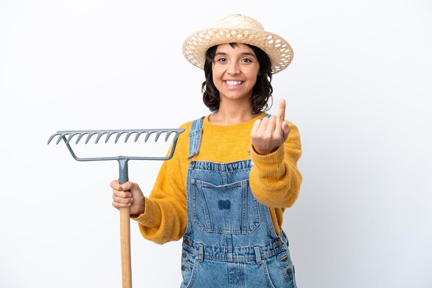 Farmer woman isolated on white background doing coming gesture