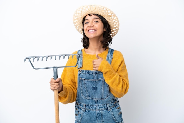 Farmer woman isolated on white background giving a thumbs up gesture