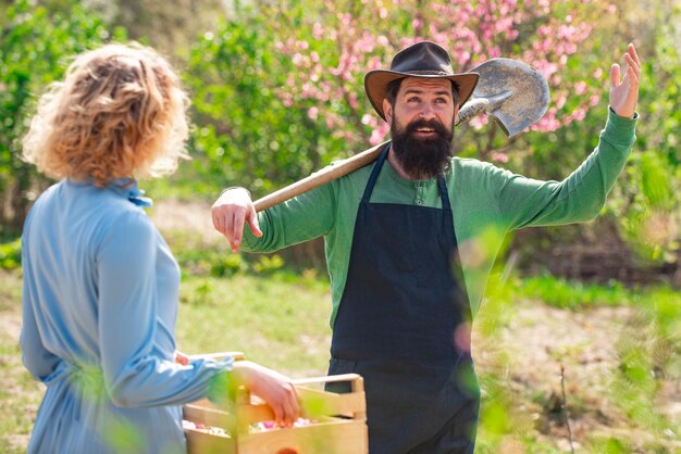 Farmers couple working in field portrait of pair of farms working in garden together couple in the f