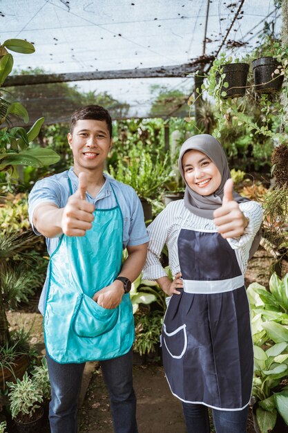 Farmers with thumbs up