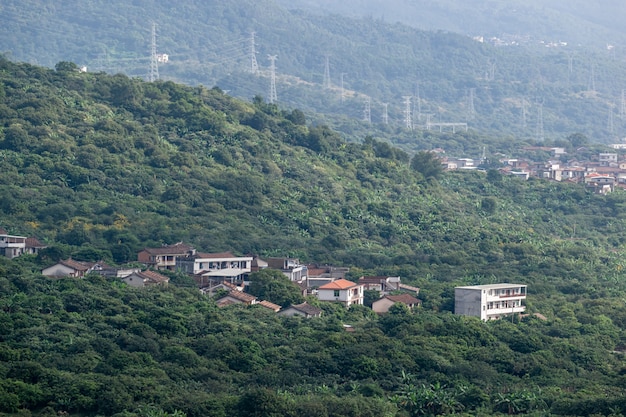 Farmhouse in the forest on the hillside