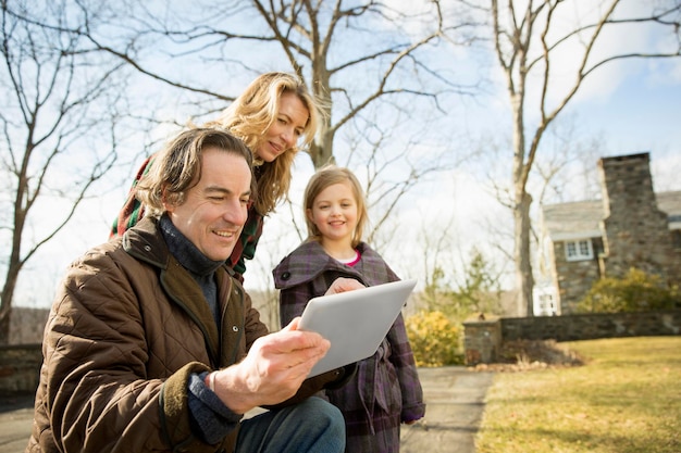 Farming family man holding a digital tablet