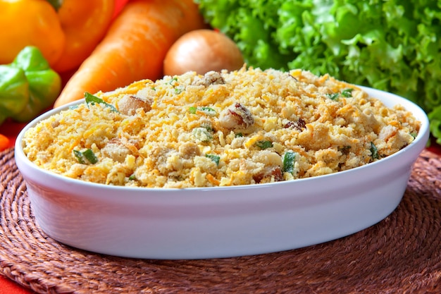 Farofa - Bowl of manioc flour cooked with butter. Traditional Brazilian side dish.