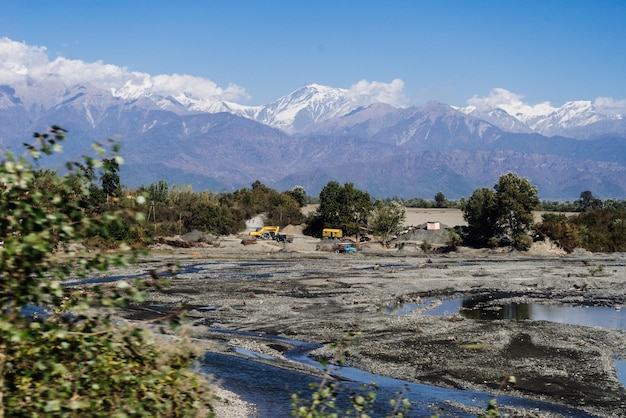 Fascinating landscape and magical nature majestic high mountains covered with white snow under a blue sky