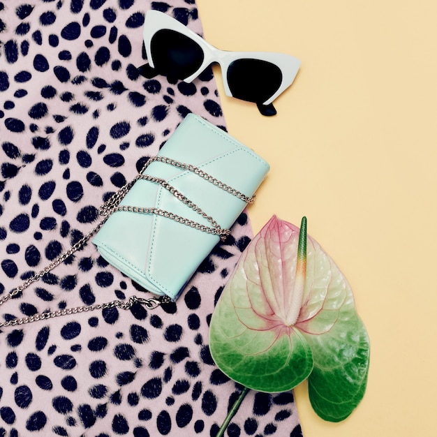 Fashion Accessories Ladies. Stylish Sunglasses and clutch. Pastel Color Trend