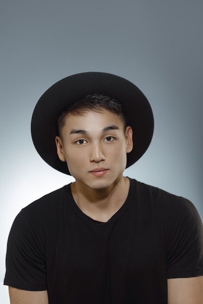 Fashion Asian Man Portrait in Black Clothes