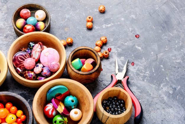 Fashion beads in wooden bowls