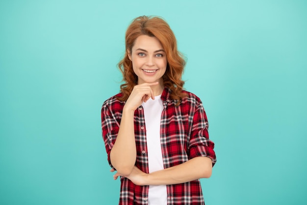 Fashion and beauty female model casual trend portrait look of young girl red haired woman happy redhead woman in checkered shirt express positive emotions smiling lady with curly hair