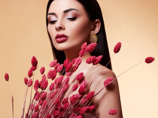 Fashion Beauty Model woman with Flowers.