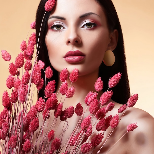 Fashion Beauty Model woman with Flowers.