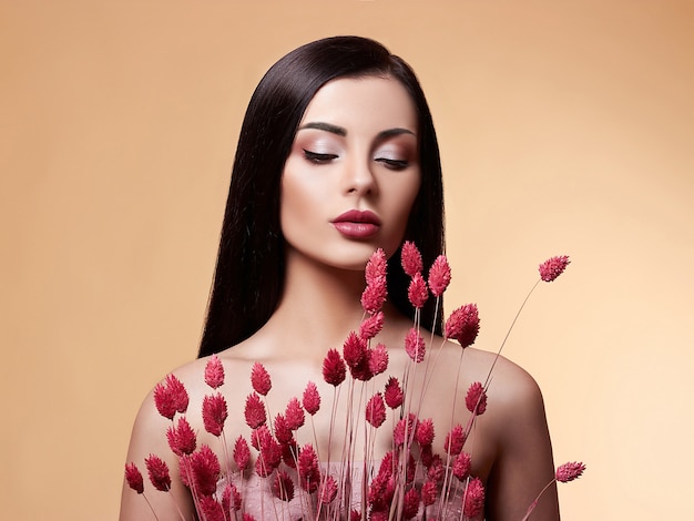 Fashion Beauty Model woman with Flowers.