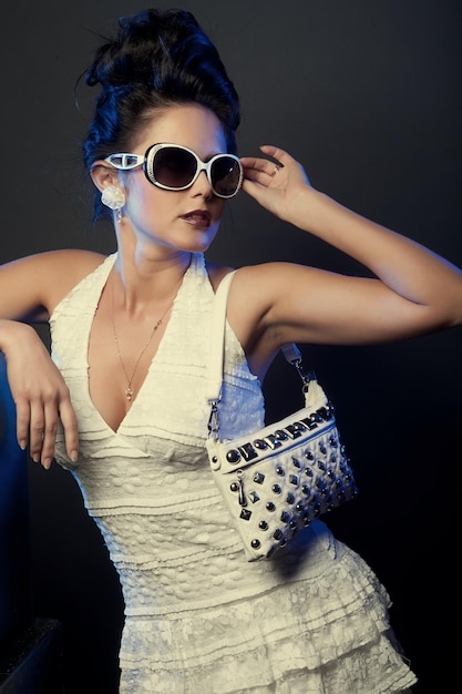 Fashion brunette lady with sunglasses