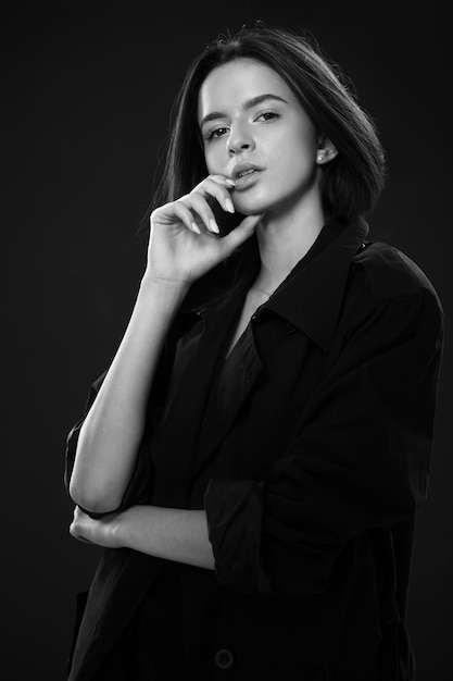 Fashion closeup portrait of young beautiful woman in hat Black and white photo