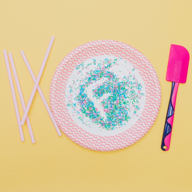 fashion conception: letter "F" by confetti on plate