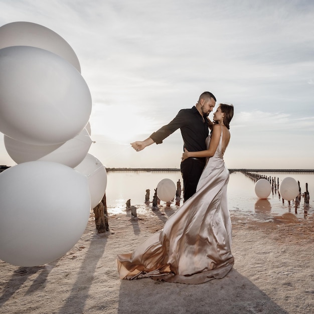 Fashion couple outdoor in luxury dress