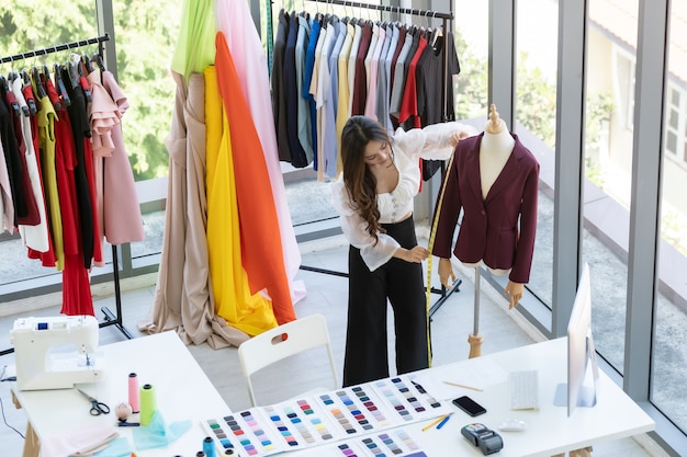 Premium Photo | Fashion designer owner working