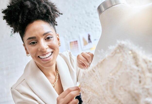 Photo fashion designer and smile with mannequin and black woman in workshop for planning manufacturing and retail creative idea and fabric with girl and couture dress in studio for small business