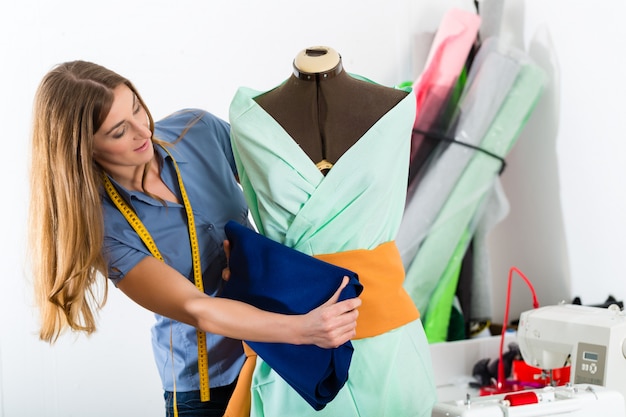 Fashion designer or tailor working in studio