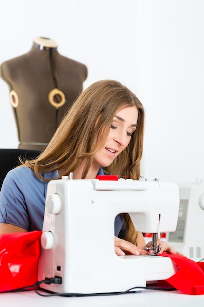 Fashion designer or tailor working in studio