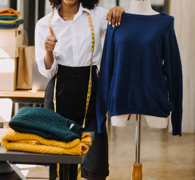 Fashion designer woman working on her designs in the studio