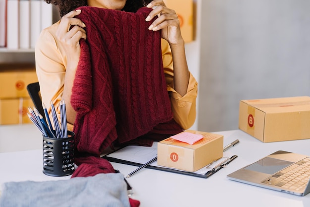 Fashion designer woman working on her designs in the studio