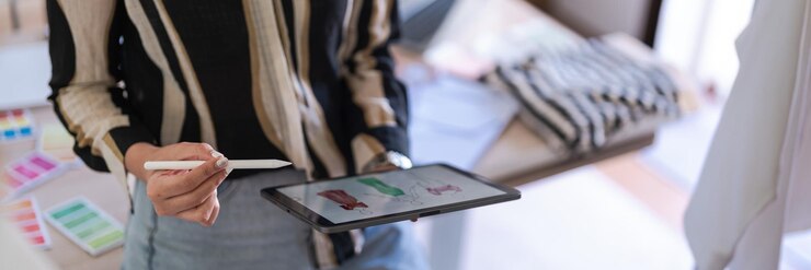 Photo fashion designer women work on tablet to designing dress and sketching for creative new collection