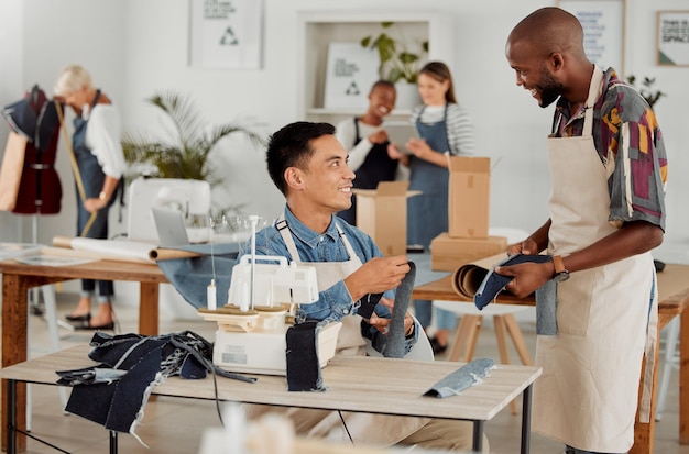 Fashion designers colleagues and men sewing clothes in a workshop Happy diverse and smiling young creatives planning garment designs in a textile clothing and manufacturing studio or factory