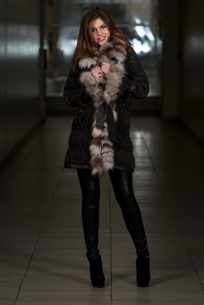 Fashion Girl Wearing Snow Jacket In Shopping Mall