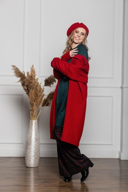 Fashion and glamour concept  stylish woman in a beret and coat on a light background coat beret clothes style fashion beauty young woman