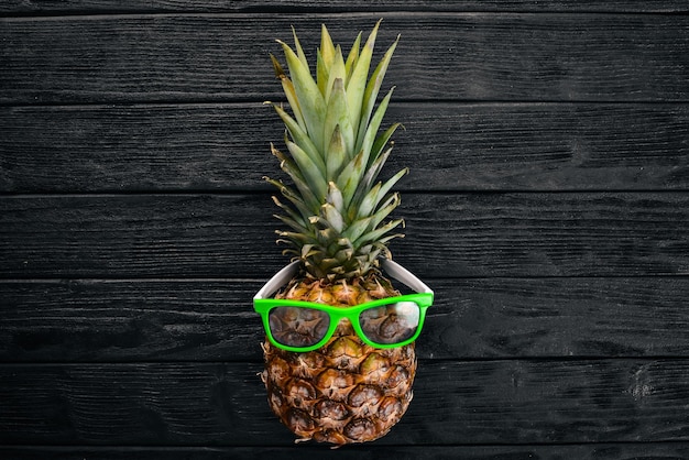 Fashion Hipster Pineapple Fruit Tropical pineapple with Sunglasses Creative Art concept Top view Free space for text