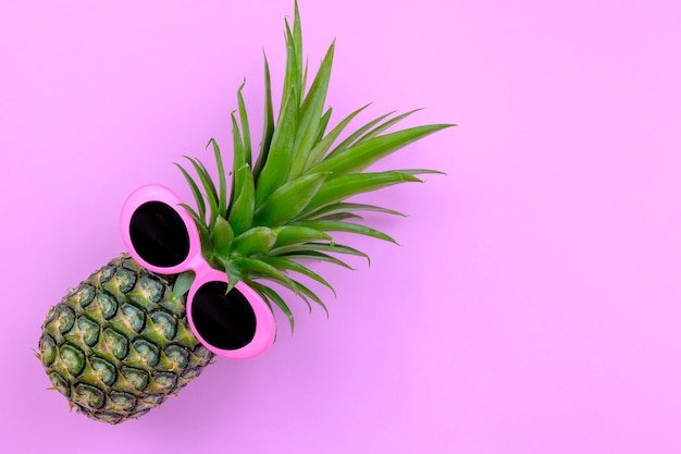 Fashion Hipster Pineapple on pink color background, Bright Summer Color, 