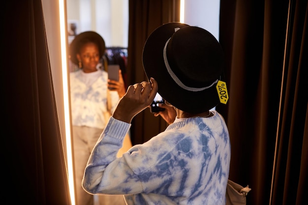 Fashion influencer filming video in fitting room