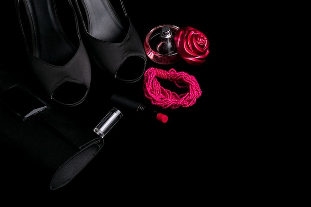 Fashion Lady Accessories Set. Black and pink. Minimal. Shoes, bracelet, perfume, lipstick and bag . Flat lay.