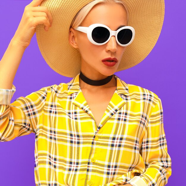 Fashion Lady in a straw hat and checkered shirt. Country Stylish accessories