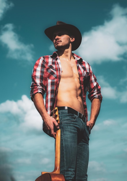 Fashion male model man wearing a cowboy hat