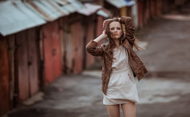 Fashion Model Girl on Industrial Background of Metal Texture Style of Grunge Brutal Gothic