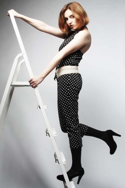 Fashion model on the ladder