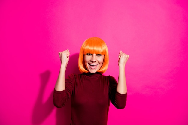 Fashion model posing with orange wig