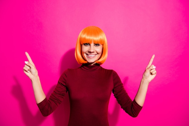 Fashion model posing with orange wig