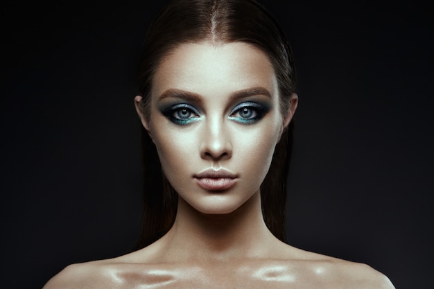 Fashion model Woman with fantasy make up. Long blowing brown hair.