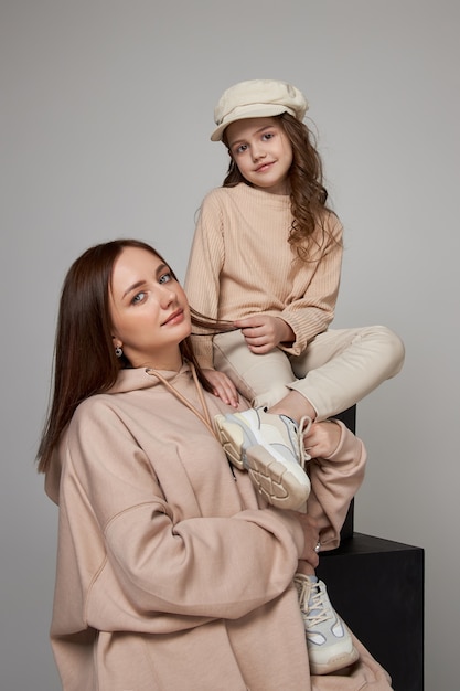 Fashion mother and daughter posing