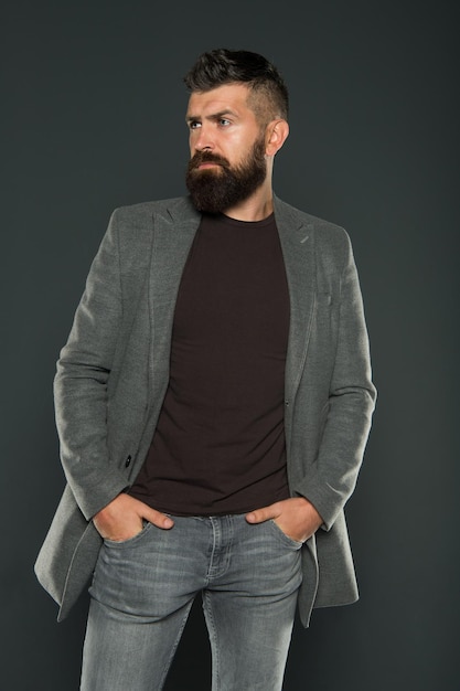 Fashion outfit Masculine look Brutal hipster man Hipster wearing casual clothes Hipster beard and stylish haircut Bearded man trendy hipster style Monochrome style outfit Classy but modern