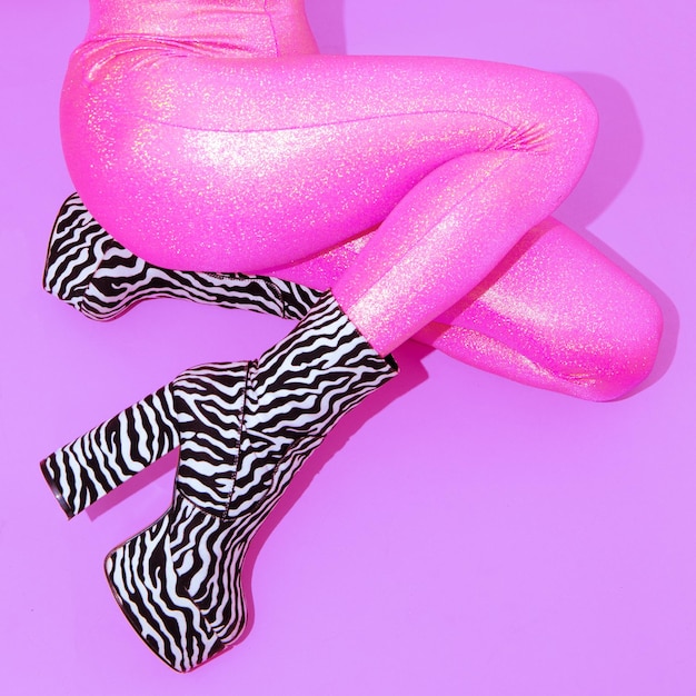 Fashion Party Girl in pink glitter leggins and zebra boots Club Disco style 90s Minimal concept