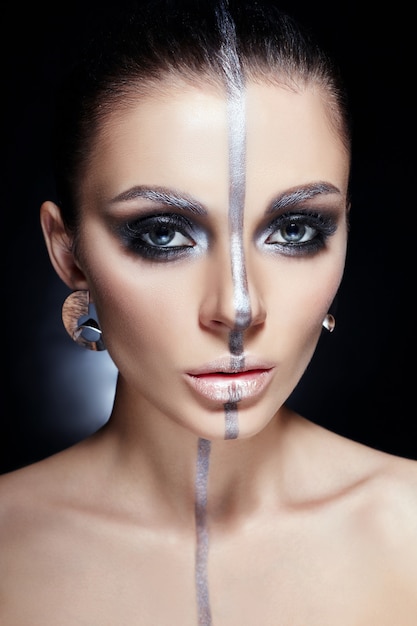 Fashion Perfect makeup, silver color band on the girl face, silver eyebrows