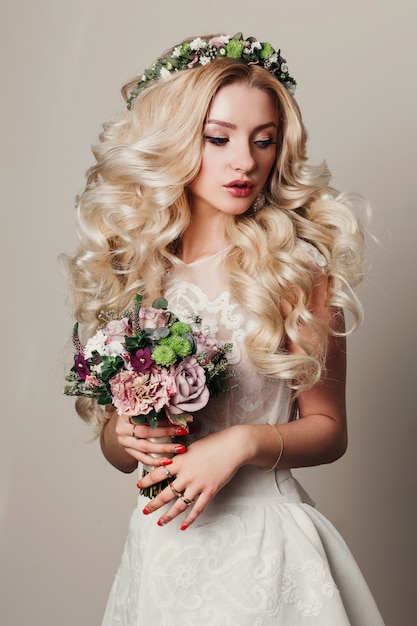 Fashion photo of young bride girl with long curly hair