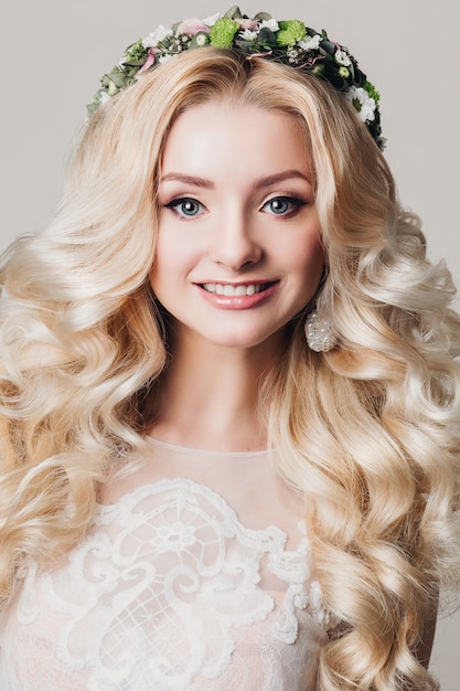 Fashion photo of young bride girl with long curly hair