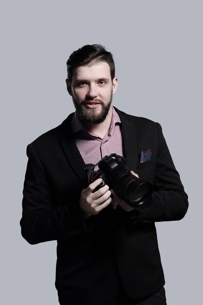 Fashion photographer in a suit with a cameraphoto with copy space