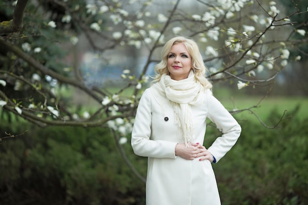 Fashion portrait of beautiful blonde woman in stylish clothes outdoor in autumn Peace in Ukraine High quality photo